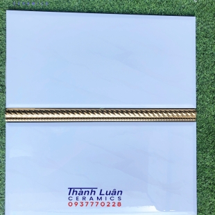Gạch ốp tường 30x60 trắng bóng kiếng viền vàng