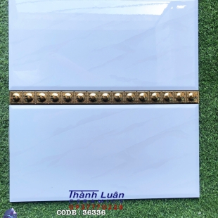 Gạch ốp tường 30x60 bóng kiếng viền vàng nổi